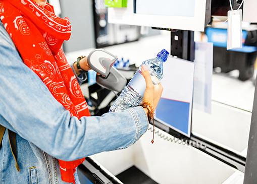 Scanning a water bottle at self checkout