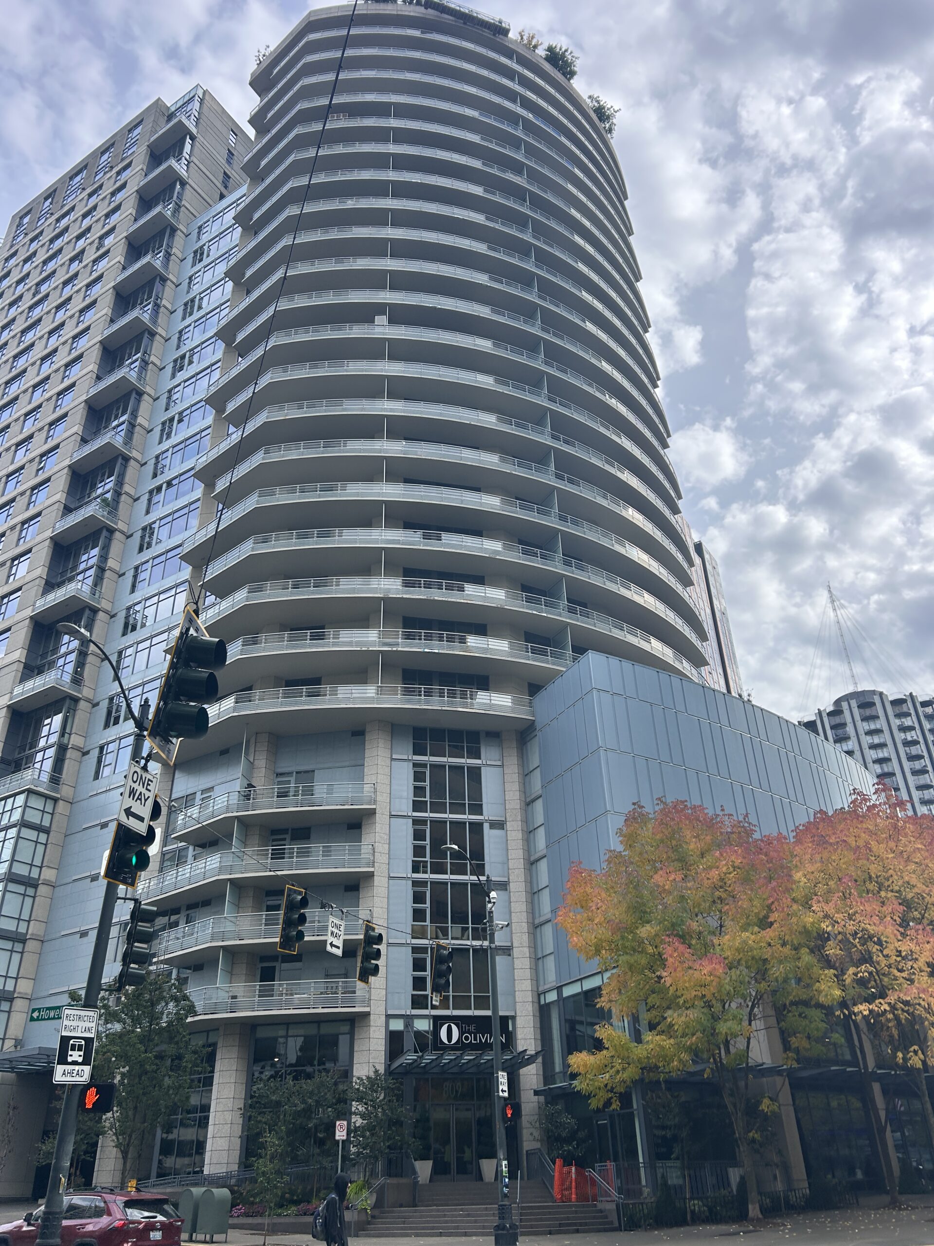 Exterior of a multifamily high-rise apartment building that relies on vertical package distribution as viewed from street level in an urban setting